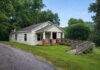 L-Shaped City Lot Fixer-Upper Offering Strong Redevelopment Potential in a Growing Urban Area