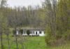 Prime 13.4-Acre Property Featuring a Large 4-Bedroom Residence