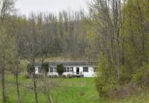 Prime 13.4-Acre Property Featuring a Large 4-Bedroom Residence