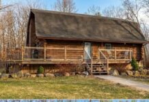 Private Log Cabin Retreat on 5 Scenic Acres Featuring a Pond, Pool, and Spacious Workshop