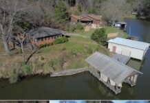 Waterfront Retreat with 400 Ft Shoreline & Boathouse – Move-In Ready on Lease Land $149,900
